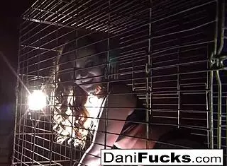 Sexy Dani Daniels in a cage for solo play