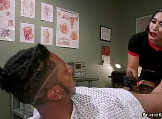 Why is this busty asian domme tormenting that black guy so intensely?