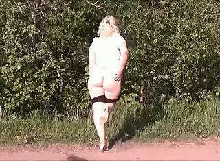 Hot blonde with big ass and natural tits gets a massage in mini shorts.