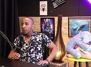 Sensual black top shows broken cock scar.