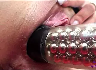 Girls touch and lick on orange couch