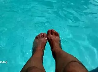 feet in the pool with a lot of water, young 18+ amateurs enjoying the moment