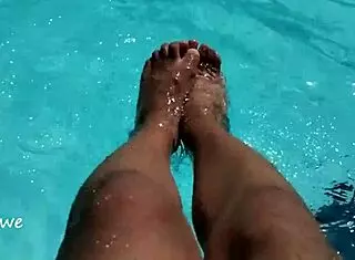 feet in the pool with a lot of water, young 18+ amateurs enjoying the moment