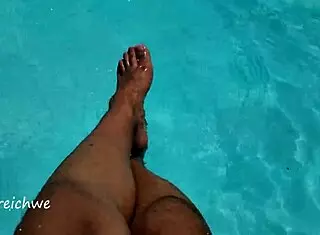 feet in the pool with a lot of water, young 18+ amateurs enjoying the moment