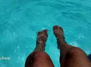 feet in the pool with a lot of water, young 18+ amateurs enjoying the moment