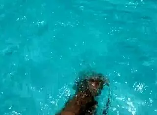feet in the pool with a lot of water, young 18+ amateurs enjoying the moment