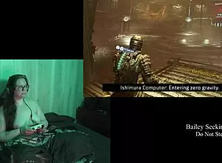 Naked brunette plays Deadspace part 8, embracing her natural curves in the game