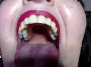 Giantess towers over nils, scoops him up to devour whole