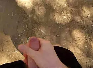 Hairy guy jerks off in public bush