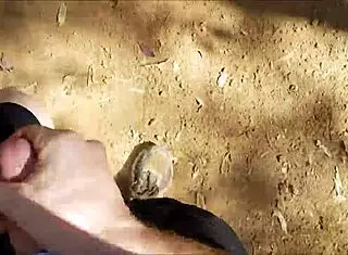 Hairy guy jerks off in public bush