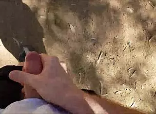 Hairy guy jerks off in public bush