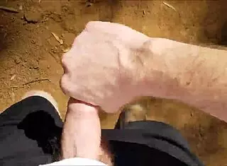 Hairy guy jerks off in public bush