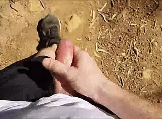 Hairy guy jerks off in public bush