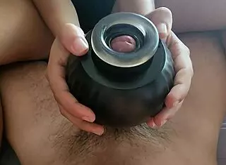 Is she using the massage pump on her big cock until orgasm?