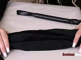 blonde slave tied up by dom in bondage