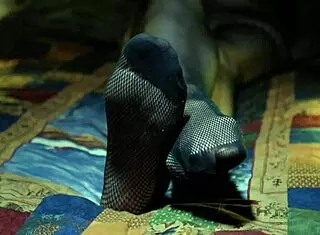 Perfect toes peeking through sexy fishnets