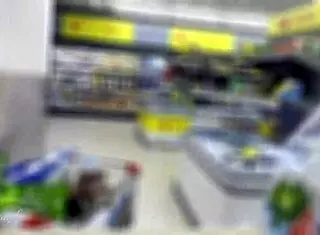 In the supermarket, she helps a guy with a big cock get a risky public cumshot through handjob and spitting