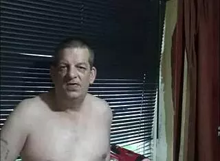 Shy naked guy masturbates at window in homemade solo