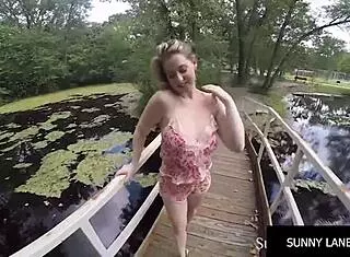 Sunny Lane Teases Hot and Blonde in Forest Scene