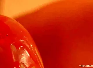 Why is busty Eveline E masturbating with wax?