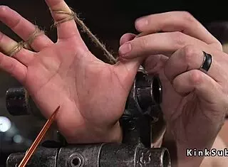 brunette slave endures rough anal hook in dark dungeon