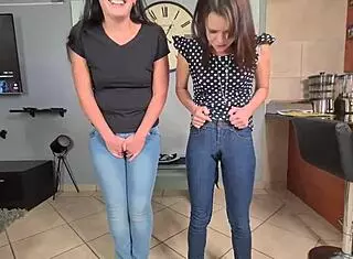 Two piss sluts soak their jeans with pee then start undressing
