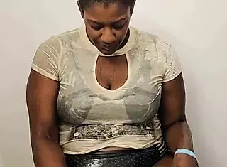 Ebony babe wet in shower, fully clothed! 🛁