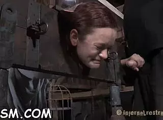 Brunette babe engulfs hard toy weenie in wild fetish play with slave