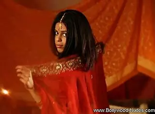 beautiful brunette indian girl does striptease and dances nude