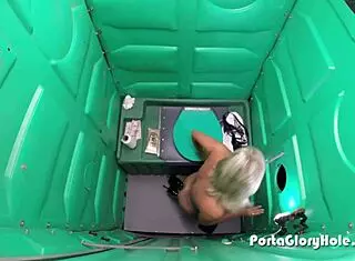 Mature blonde heads to porta potty gloryhole for public sucking and swallowing cocks outdoors