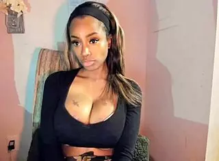 Tattooed ebony MILF with big tits FUCKS her pussy hard!