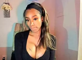 Tattooed ebony MILF with big tits FUCKS her pussy hard!