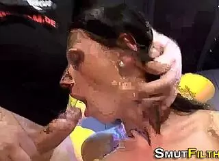 the euro fetish slut sucks multiple cocks in a bukkake scene.