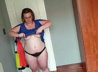 Fat girl trying on kinky dresses for solo fun