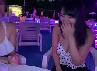 Japanese babe rides in night pool with big tits