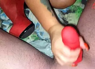 She jerked off her stepson using a red stocking in the bedroom.
