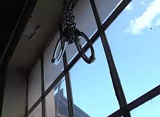 struggling babe in lesbian bondage scene