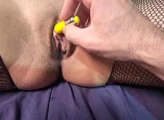 using a toy on my wife's pussy until she moans loudly