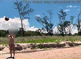 Wife plays football nude at public clothed beach for daring fun