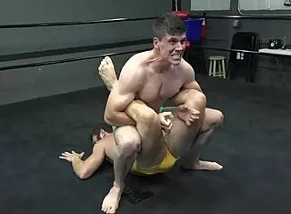 Gay erotic wrestling with intense domination in round 2