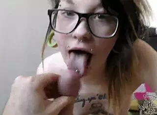 Goth girl Andy sucking with cum on her pierced tits