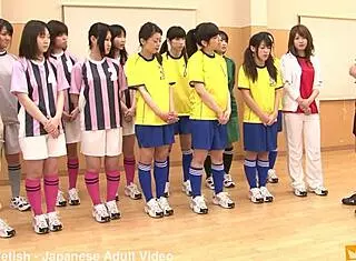 japanese female team listens and takes a lesson from their coach. cute brunette babe in costumes follows instructions closely