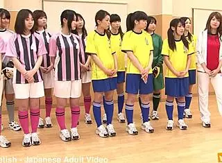 japanese female team listens and takes a lesson from their coach. cute brunette babe in costumes follows instructions closely