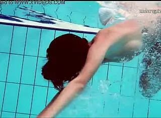 Hot European babe shows tits and shaved pussy underwater