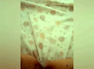 Greta warms under the blanket