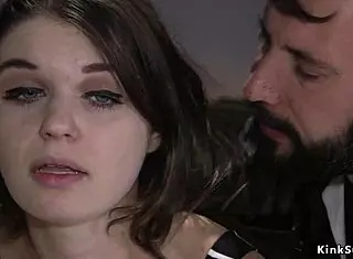 in the office, officer whips busty gagged slave.