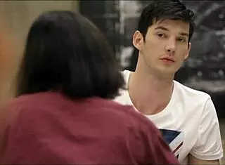 Redhead student studies with guy in room