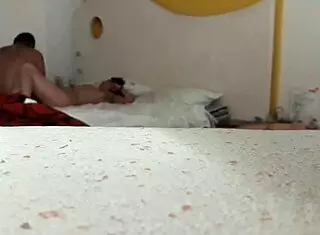 An amateur trio engages in intimate activities.