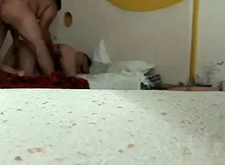 An amateur trio engages in intimate activities.