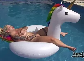 Aviva rocks masturbates on a unicorn, showcasing her big tits and ass with tattoo